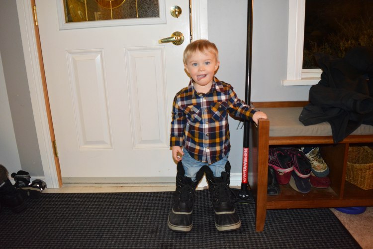H wearing his Daddy's boots.